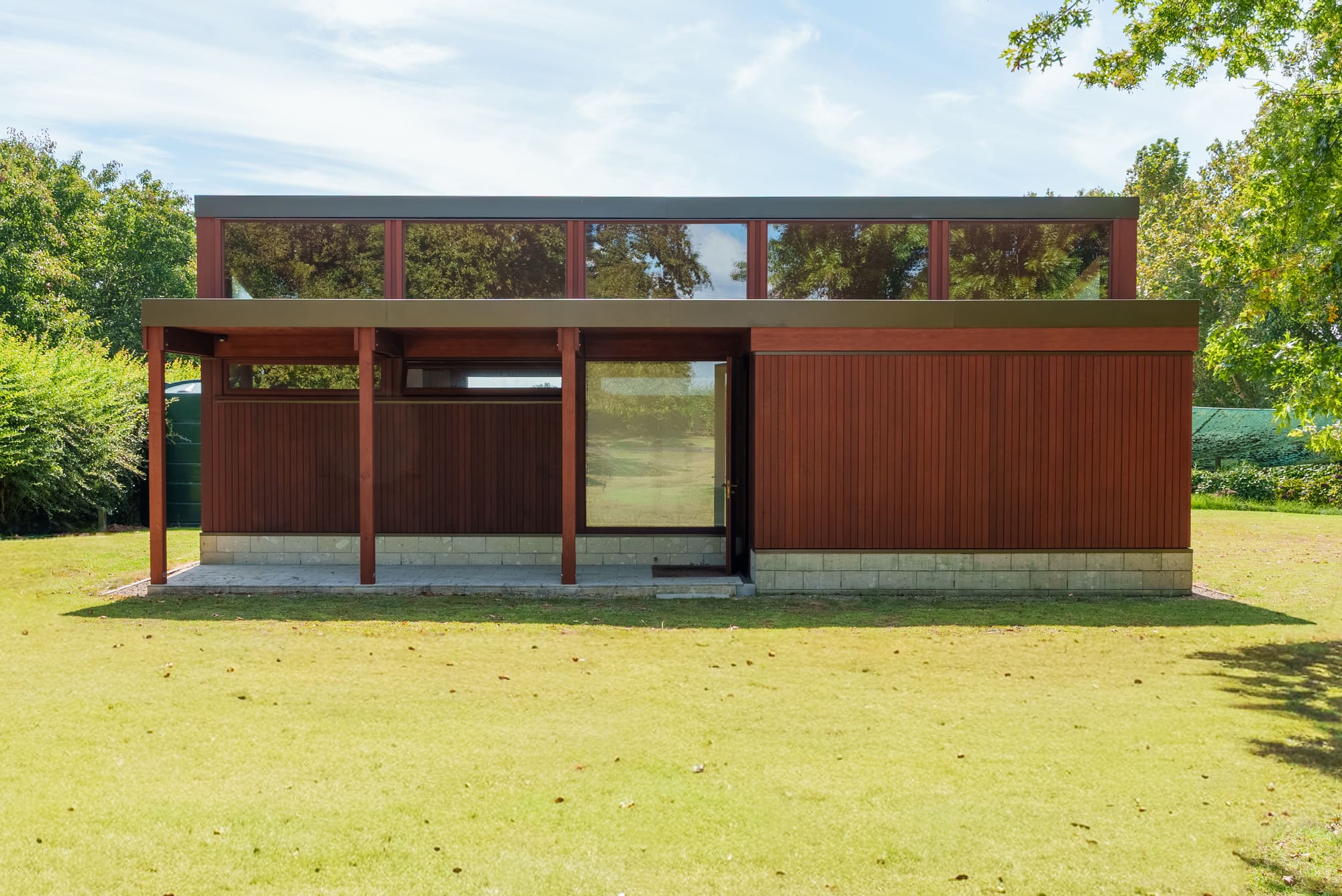 The pavilion photographed straight on, symmetrical across its length.