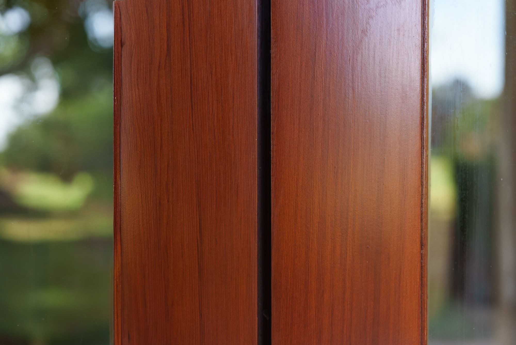 Close detail of the varnished timber, showing sheen and grain.